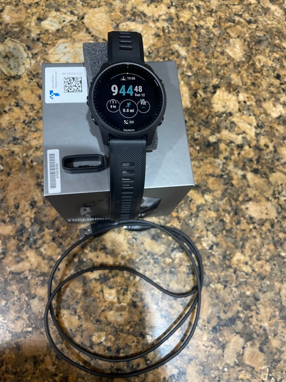 garmin black sports GPS smartwatch with black silicone band